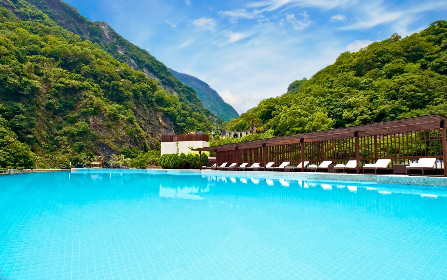 Mountain landscape reflected beside a pool