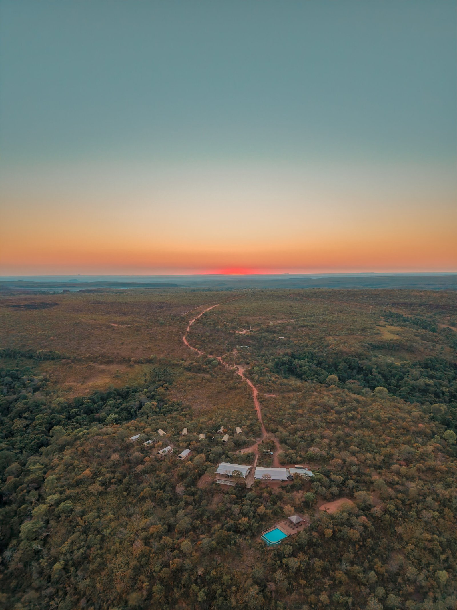 Aerial view of a coastal resort at sunset